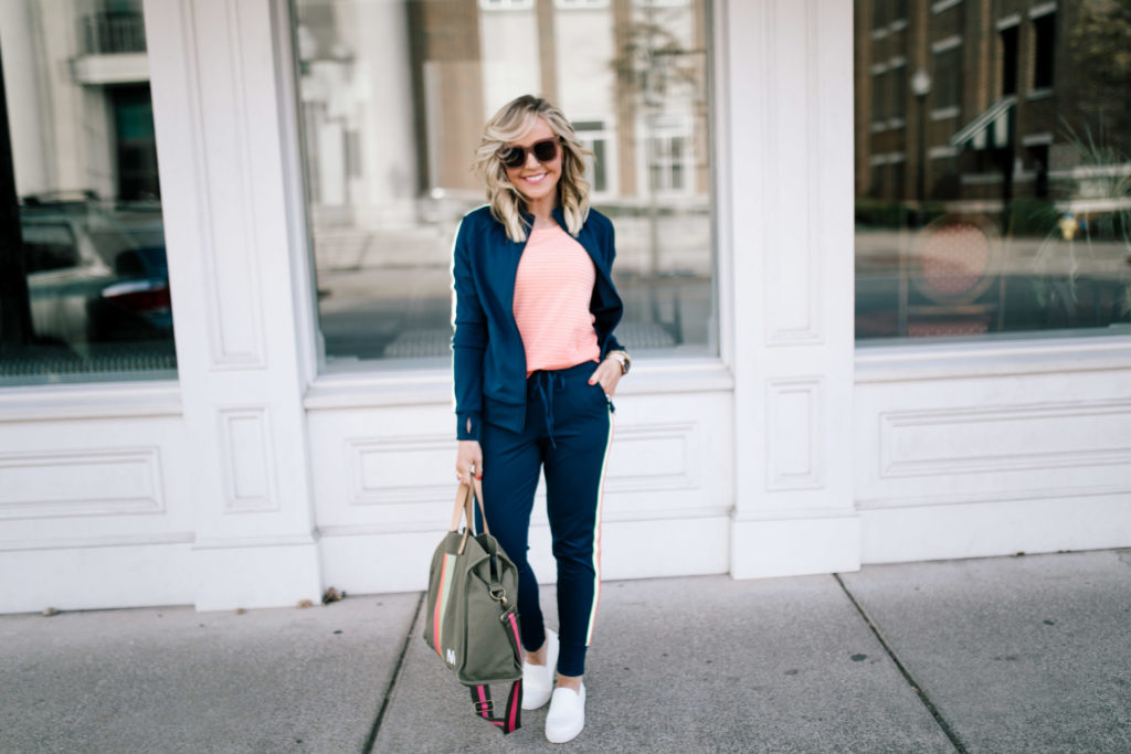 Cute Travel Outfit by popular Nashville fashion blog, Hello Happiness: image of a woman wearing a Walmart Athletic Works Women's Performance Active Ombre Stripe Tank Top, Walmart Athletic Works Women's Athleisure Retro Stripe Track Jacket, Walmart Time and Tru Platform Twin Gore Slip On Sneaker, and Walmart Athletic Works Women's Athleisure Track Jogger Pants.
