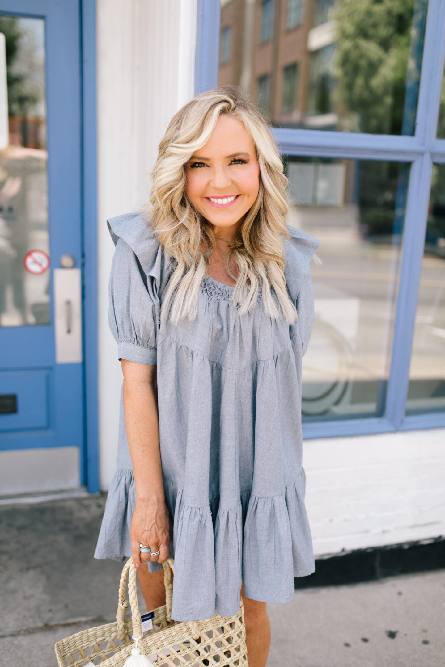 Summer Dresses by popular Nashville of Natasha Stoneking wearing a Free People Amelie Chambray mini dress  and metallic knot slide sandals. 