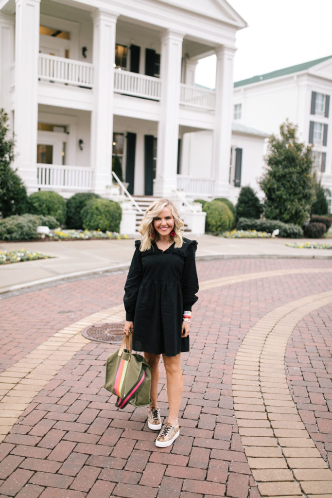 Asos Black Dress by popular Nashville fashion blog, Hello Happiness: image of a woman wearing a Asos Pieces smock dress with frill collar in black, J/Slides NYC HARLING Natural/Black Leopard Pony Leather, Bagging Rights TOTE-ALLY Bag, Red Dress It's My Way Black Gold Smoke Sunglasses QUAY AUSTRALIA, and BaubleBar ANEMONE DROP EARRINGS.
