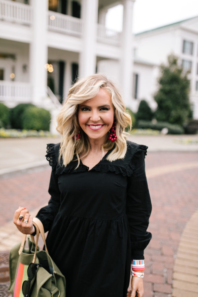Asos Black Dress by popular Nashville fashion blog, Hello Happiness: image of a woman wearing a Asos Pieces smock dress with frill collar in black, J/Slides NYC HARLING Natural/Black Leopard Pony Leather, Bagging Rights TOTE-ALLY Bag, Red Dress It's My Way Black Gold Smoke Sunglasses QUAY AUSTRALIA, and BaubleBar ANEMONE DROP EARRINGS.