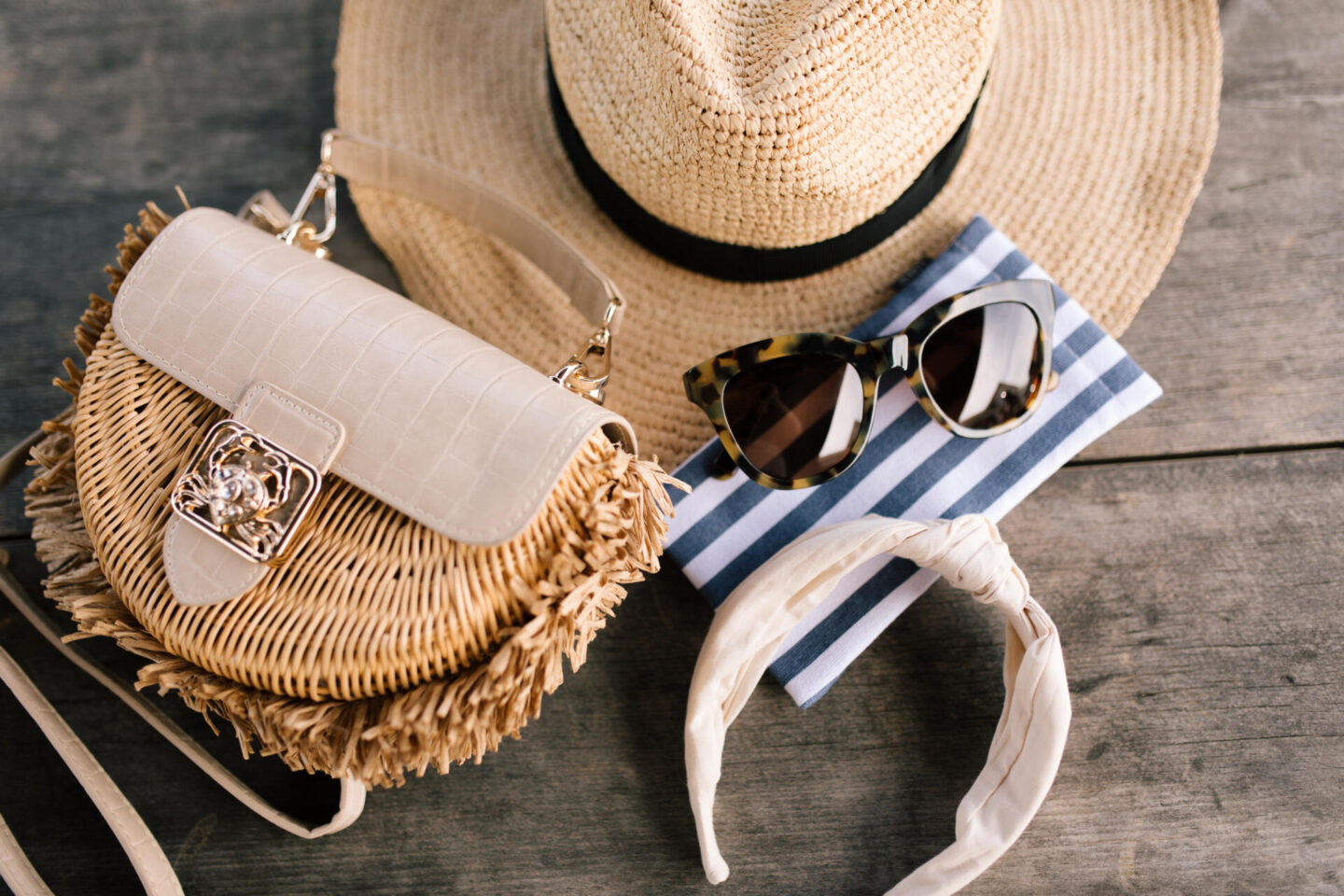 J Crew Clothing by popular Nashville fashion blog, Hello Happiness: image of a wicker purse, straw sun hat, and cream knot headband. 