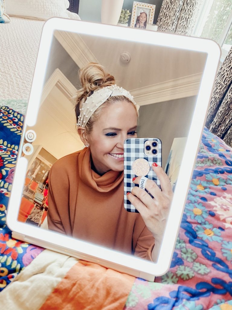 Top Amazon Products by popular Nashville life and style blog, Hello Happiness: image of a woman looking in a Amazon 3 color light makeup mirror. 