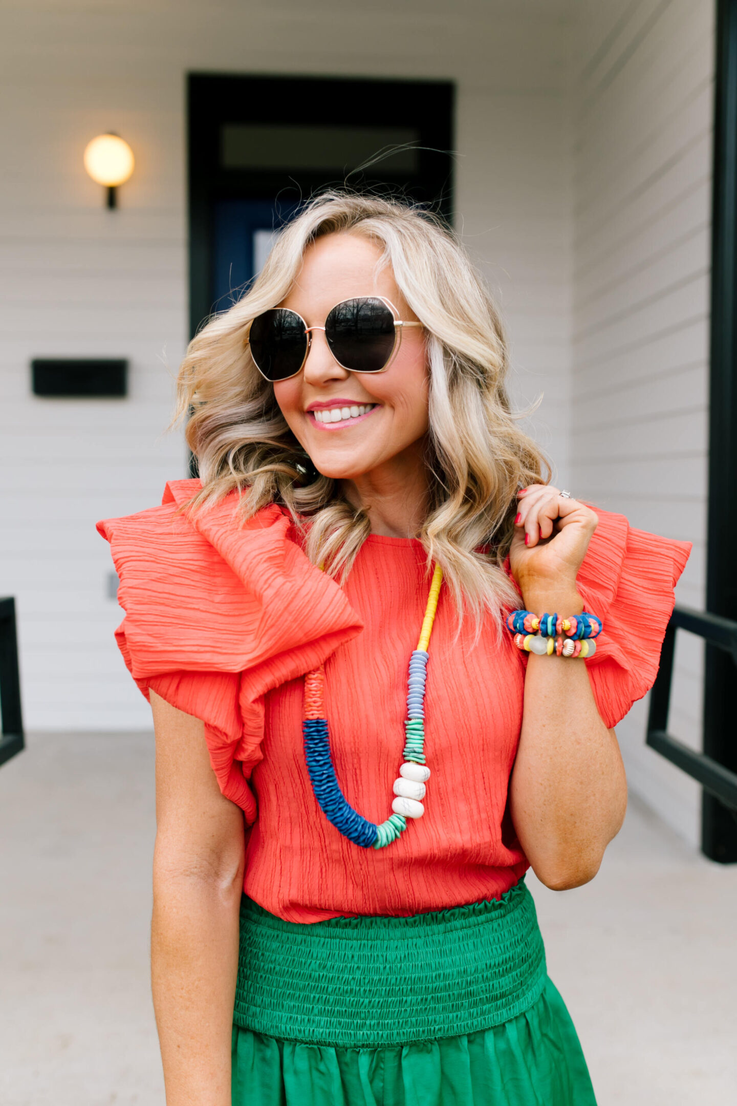 Accessory Concierge by popular Nashville fashion blog, Hello Happiness: image of Natasha Stoneking wearing a Accessory Concierge Lovely Day Necklace, Dock of the Day bracelet, Santeria bracelet, Scarlett top, Laura shorts, espadrille sandals, and holding a Luna bag. 