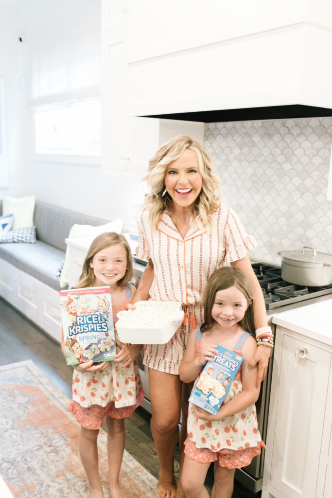 Year in Review by popular Nashville lifestyle blog, Hello Happiness: image of Natasha Stoneking and her two daughters standing together in their kitchen and holding Rice Krispies products in their hands. 