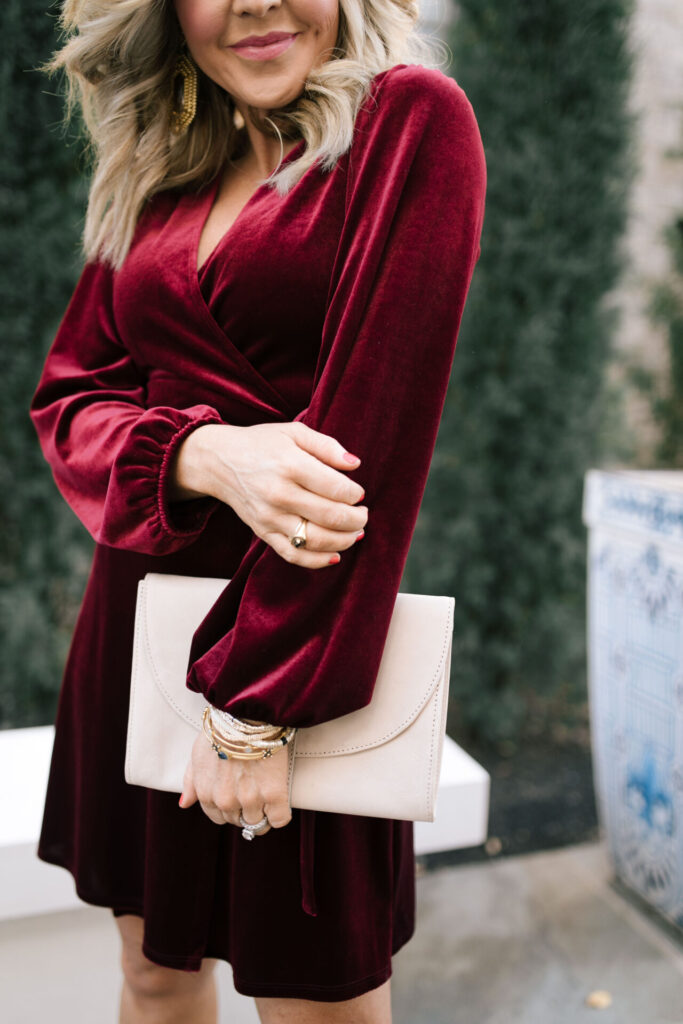 Holiday Collection by popular Nashville fashion blog, Hello Happiness: image of Natasha Stoneking wearing a Gibson x Glam velvet wrap dress. 