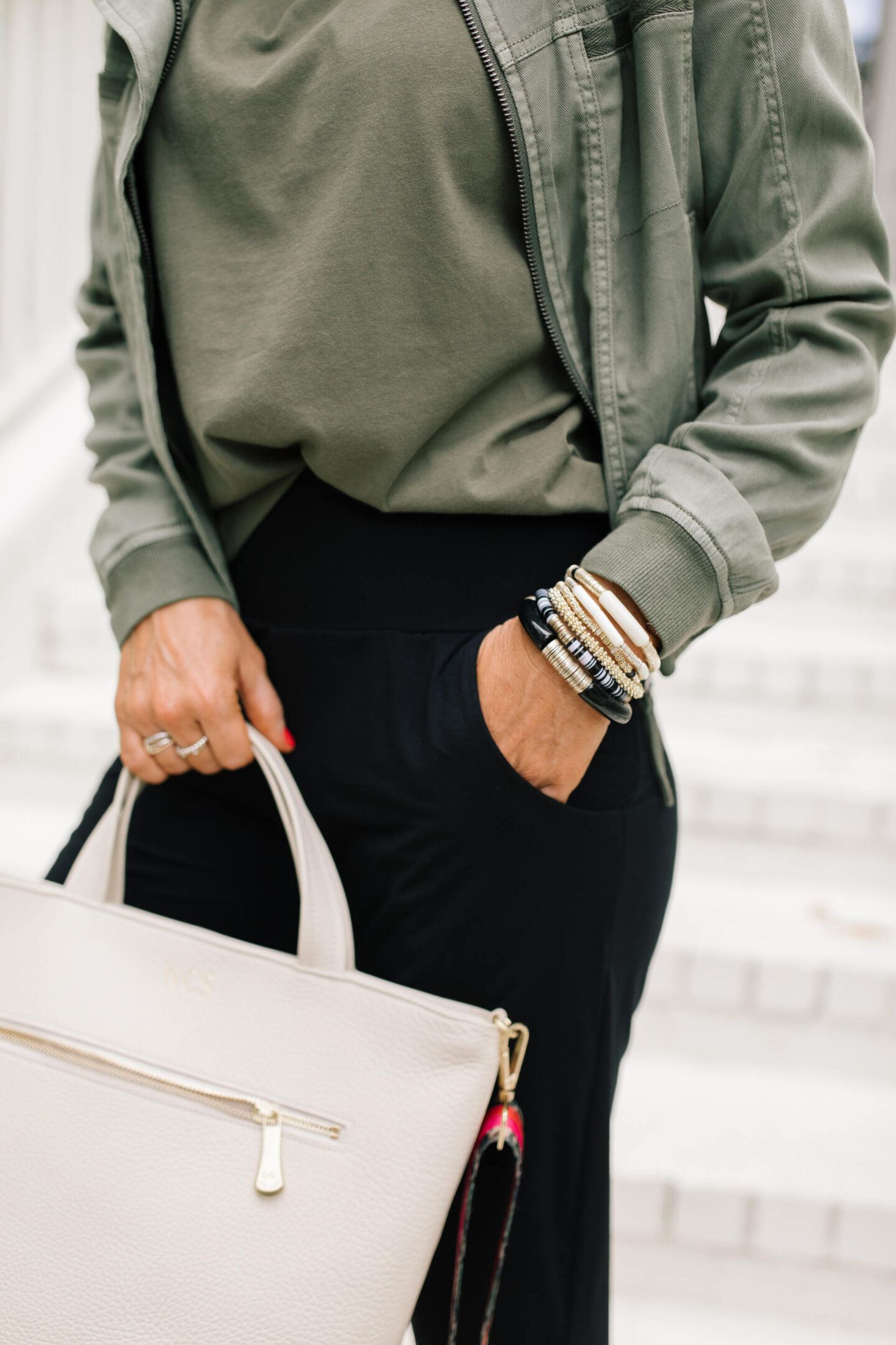 Fall Outfits by popular Nashville fashion blog, Hello Happiness: image of Natasha Stoneking wearing a Evereve Morrison jacket, commando butter jogger pants, Zina sneakers, and Shoulder pad tee. 