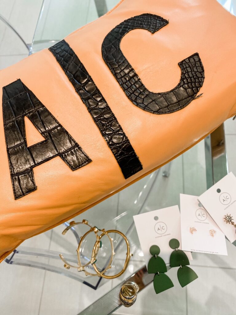 Hotel Crescent Court Dallas by popular Nashville travel blog, Hello Happiness: image of A/C jewelry and a clutch. 