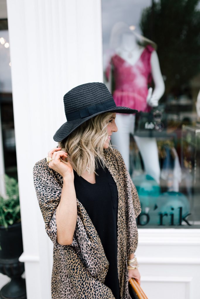 Sole Society featured by top US fashion blog Hello! Happiness; Image of a woman wearing Sole Society leopard wrap, Sole Society striped slides, Z Supply dress and Sole Society tote.