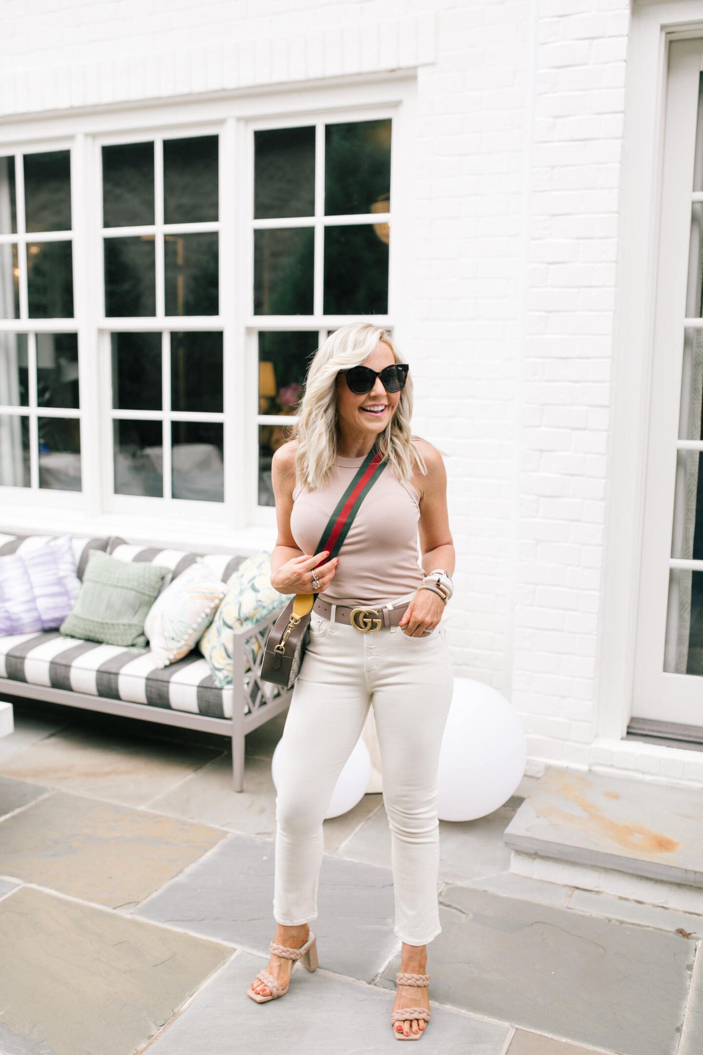 Fall Outfits by popular Nashville fashion blog, Hello Happiness: image of Natasha Stoneking wearing a Evereve ribbed tank, vanilla denim, and paily heels. 