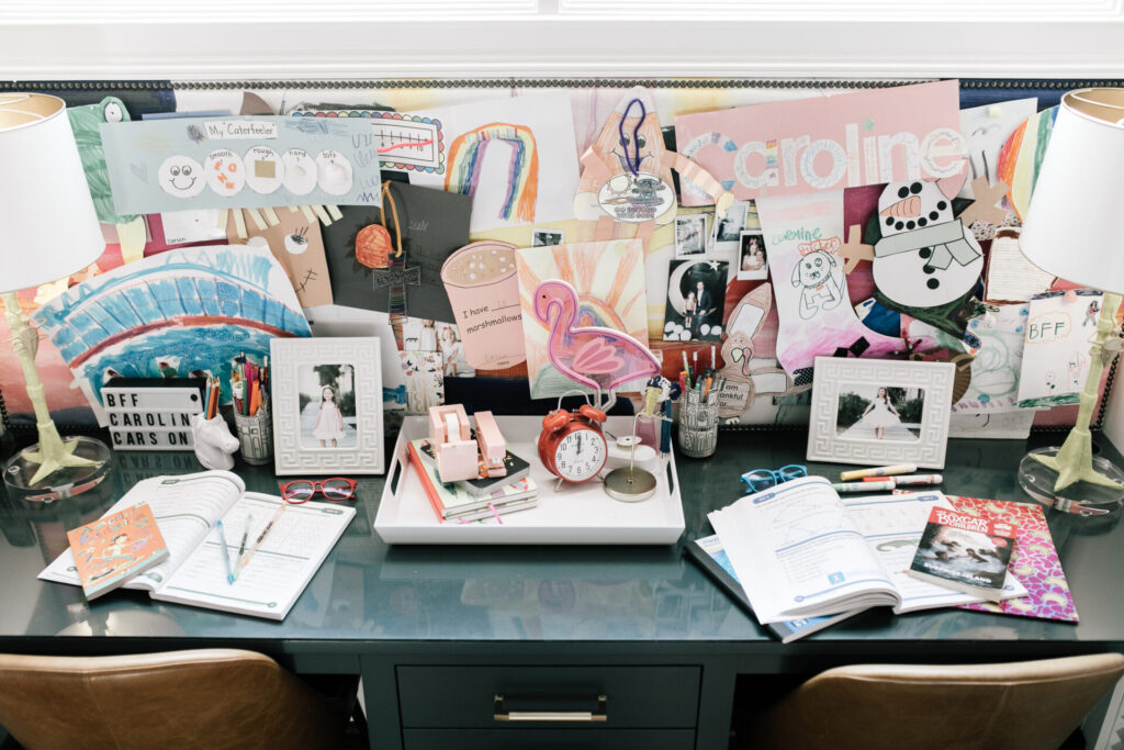 Walmart School Clothes by popular Nashville fashion blog, Hello Happiness: image of a workbook, gel pens, red frame glasses, alarm clock, pink stapler, pink tape dispenser, and Amelia Bedelia Cleans Up book. 