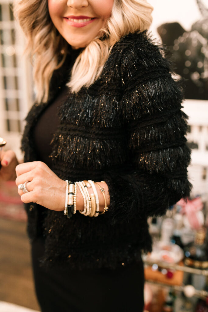 Holiday Collection by popular Nashville fashion blog, Hello Happiness: image of Natasha Stoneking wearing a collarless soft jacket and mock neck midi dress. 