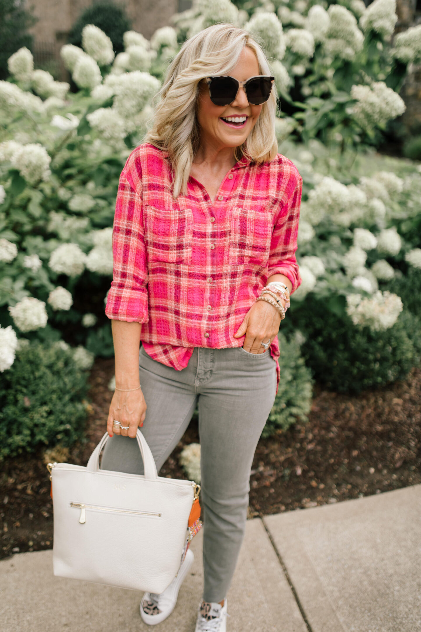 Pilcro Jeans by popular Nashville fashion blog, Hello Happiness: image of Natasha Stoneking wearing Pilcro vintage straight jeans, plaid tunic top and p448 sneakers. 