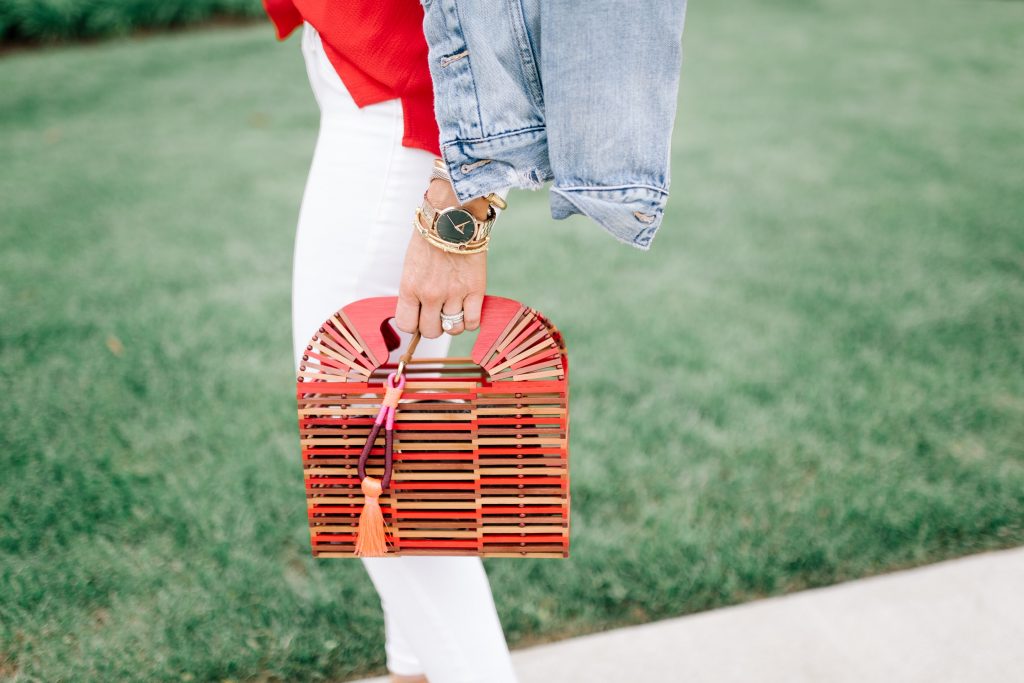 Vince Camuto Accessories featured by top US fashion blog Hello! Happiness; Image of a woman wearing Evereve top, white denim, Vince Camuto shoes and a Vince Camuto purse.