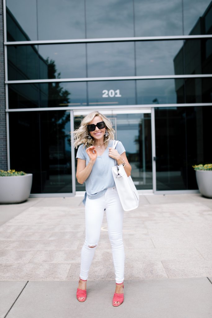 Vince Camuto Accessories featured by top US fashion blog Hello! Happiness; Image of a woman wearing white denim, Vince Camuto shoes and a Vince Camuto bag.