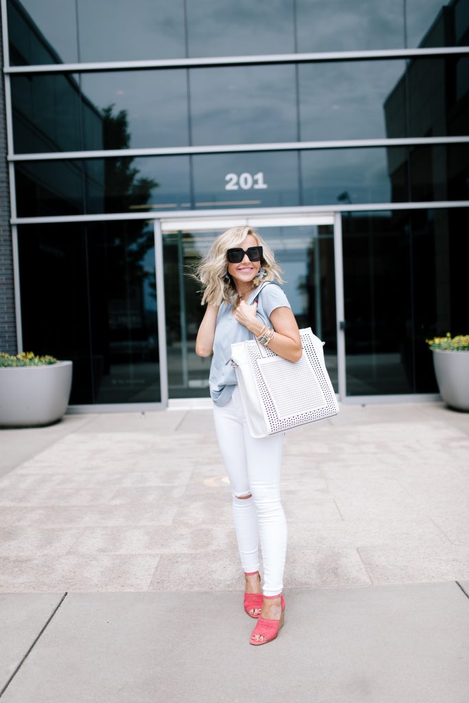 Vince Camuto Accessories featured by top US fashion blog Hello! Happiness; Image of a woman wearing white denim, Vince Camuto shoes and a Vince Camuto bag.