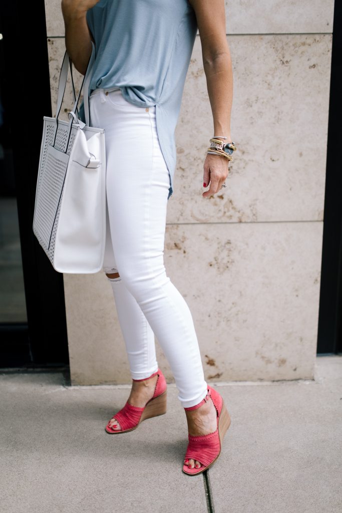 Vince Camuto Accessories featured by top US fashion blog Hello! Happiness; Image of a woman wearing white denim, Vince Camuto shoes and a Vince Camuto bag.