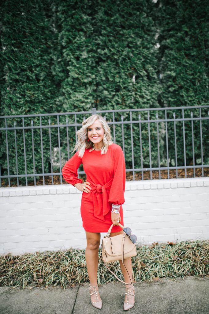 All About the Love... What to Wear on Valentine's Day! by popular Nashville fashion blog, Hello Happiness: image of a woman standing outside and wearing a Amazon R.Vivimos Women's Autumn Winter Cotton Long Sleeves Elegant Knitted Bodycon Tie Waist Sweater Pencil Dress, Candy Baublez enamel bracelets, Sole Society RUBIE CROSSBODY, and Sole Society TIIA Studded t-strap heel.