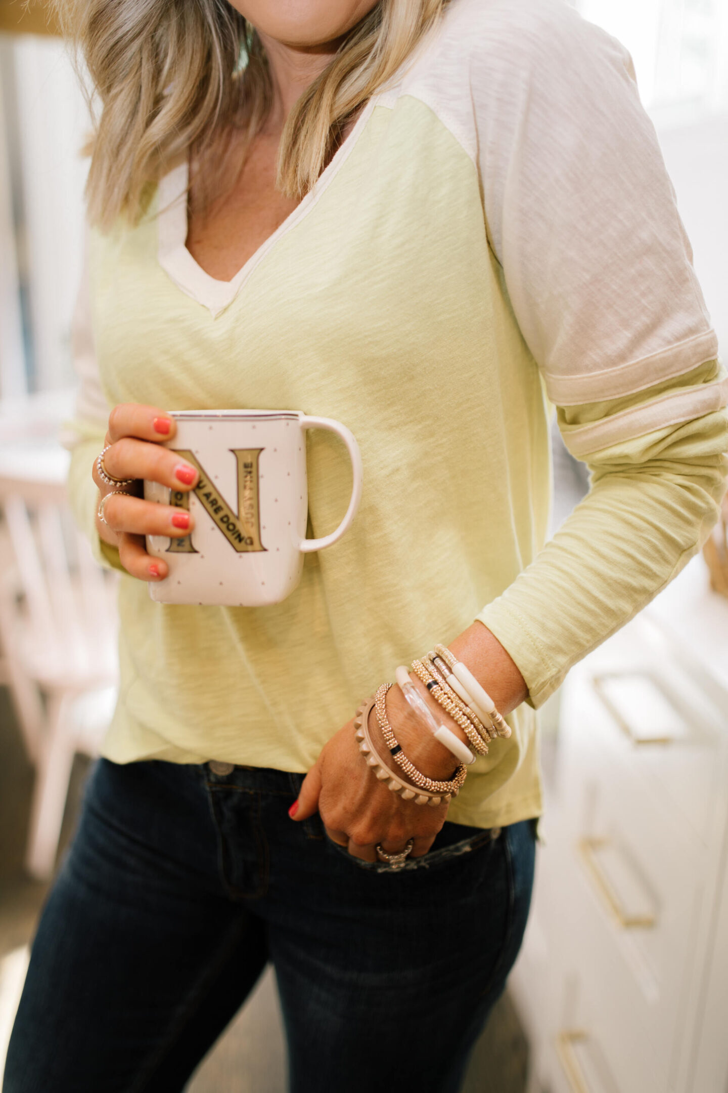 Pilcro Jeans by popular Nashville fashion blog, Hello Happiness: image of Natasha Stoneking wearing Pilcro slim boyfriend jeans, v-neck graphic tee, and p448 sneakers. 