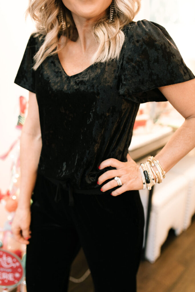 Holiday Collection by popular Nashville fashion blog, Hello Happiness: image of Natasha Stoneking wearing a Gibson x Glam flutter sleeve top and velvet joggers. 