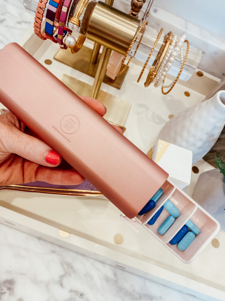 Amazon Favorites by popular Nashville fashion blog, Hello Happiness: image of a Amazon rose gold pill case.