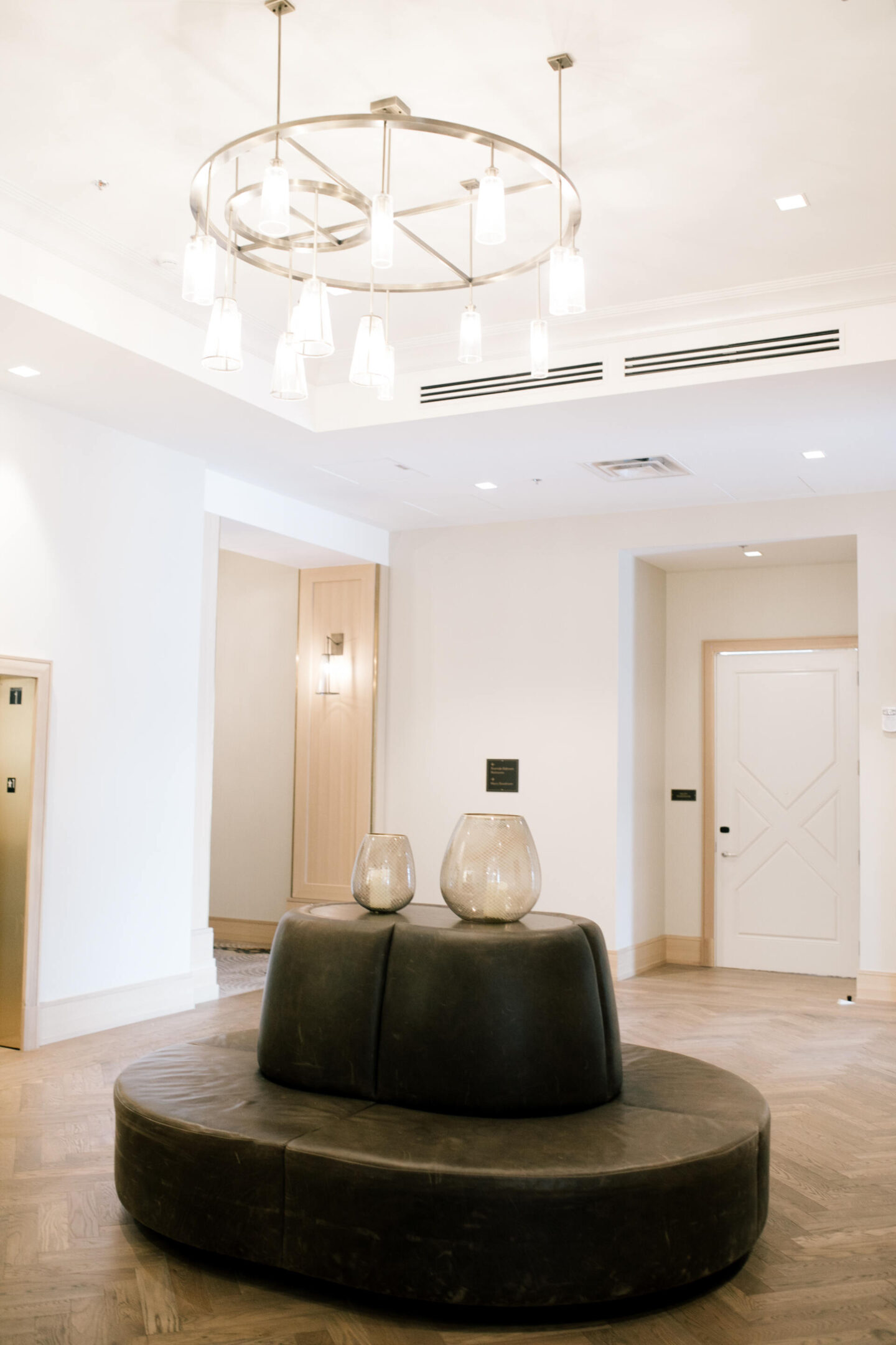 Harpeth Hotel by popular Nashville travel blog, Hello Happiness: image of a black leather oval shaped bench at the Harpeth Hotel.