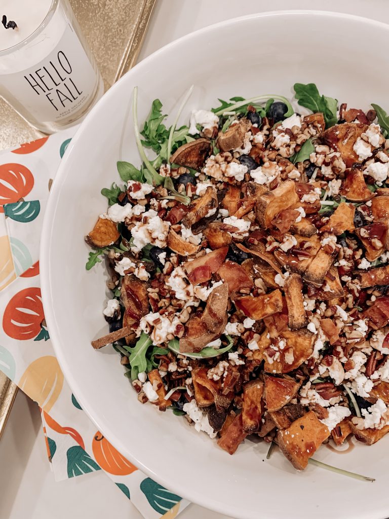 Good Eats | Roasted Sweet Potato Salad by popular Nashville life and style blog, Hello Happiness: image of a roasted sweet potato salad in a Target Gordon Ramsay by Royal Doulton Maze Stoneware 66oz Serving Bowl, a Target Spritz 30ct Harvest Rectangular Napkin, and a Sweet Water decor Hello Fall Candle.