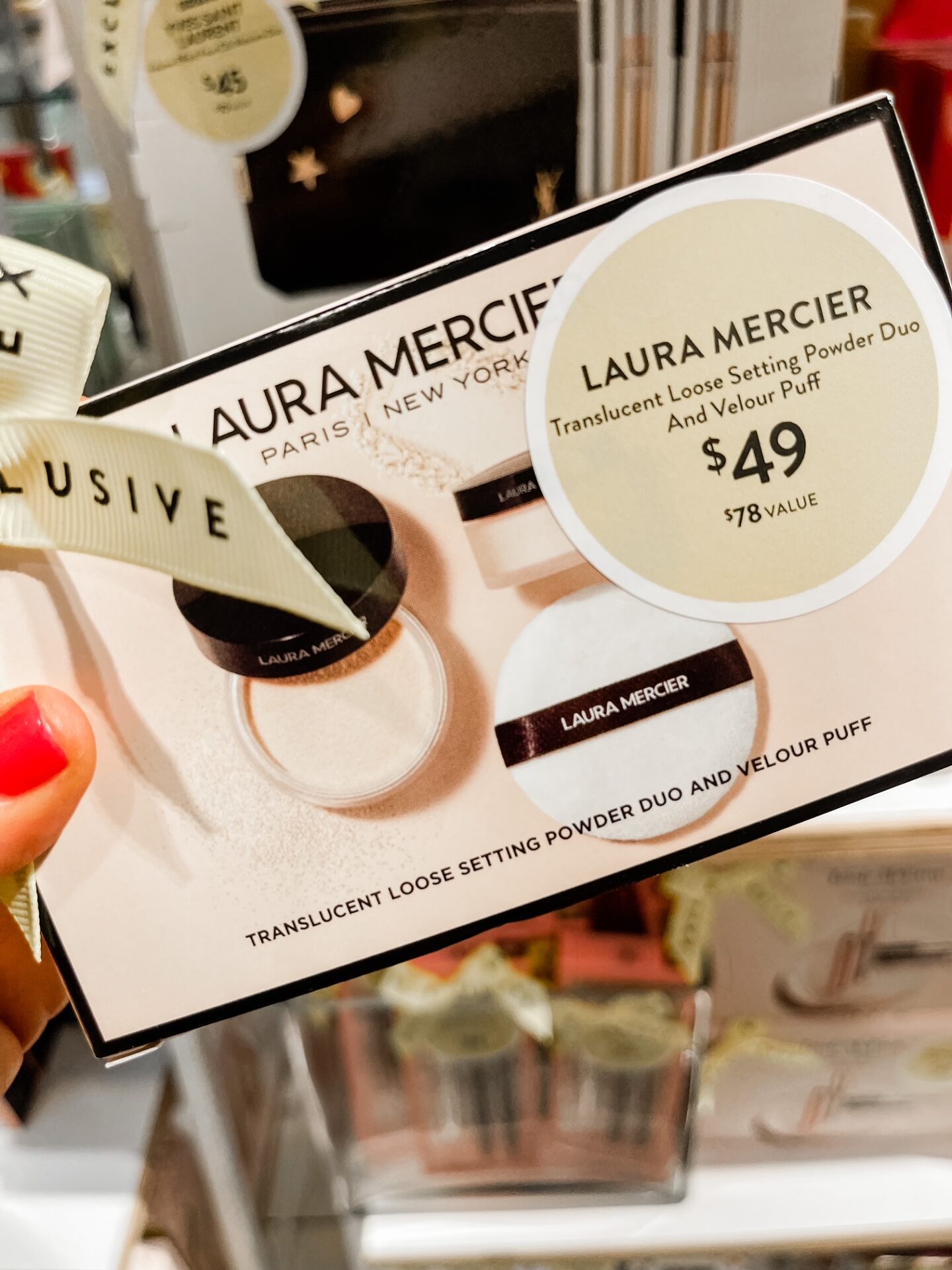 Nordstrom Anniversary Sale by popular Nashville fashion blog, Hello Happiness: image of Natasha Stoneking holding a Nordstrom Laura Mercier translucent setting powder duo. 