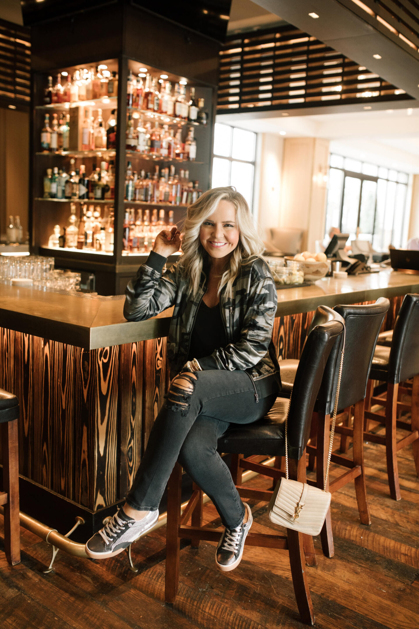 Harpeth Hotel by popular Nashville travel blog, Hello Happiness: image of Natasha Stoneking sitting at a bar a the Harpeth Hotel. 