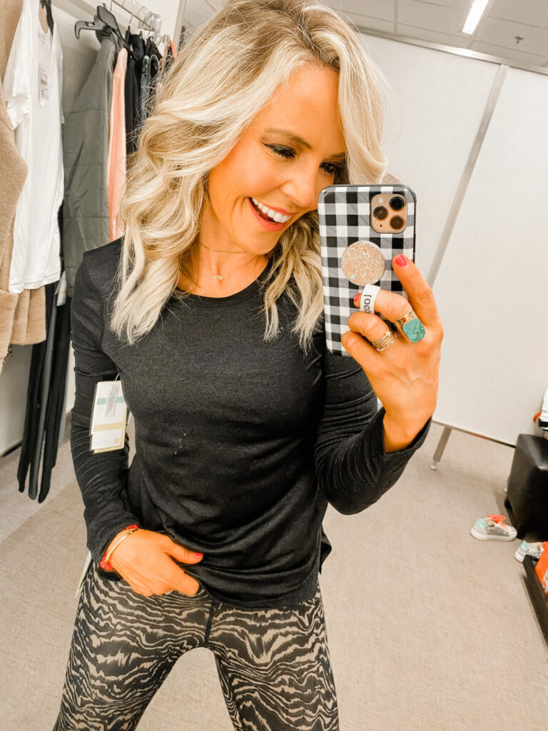 Nordstrom Anniversary Sale by  popular Nashville fashion blog, Hello Happiness: image of Natasha Stoneking wearing a Nordstrom Liana Long Sleeve Recycled Blend Performance T-Shirt ZELLA and Nordstrom Studio Lite High Waist Print 7/8 Leggings ZELLA.