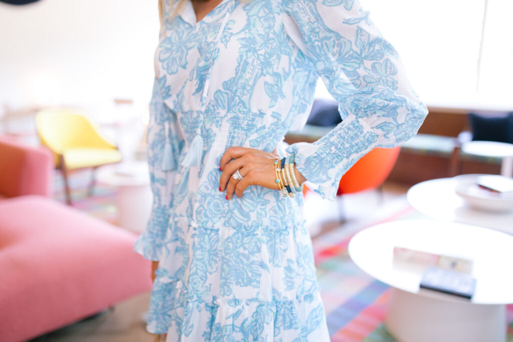 Sail to Sable by popular Nashville fashion blog, Hello Happiness: image of a woman wearing a Sail to Sable BLUE TOILE PRINT dress, See by Chloe Glyn Wedge Espadrilles, BaubleBar BIRCH DROP EARRINGS, and holding a Amazon Miuco Women Nets Bucket Handbags Straw Tote Bag.