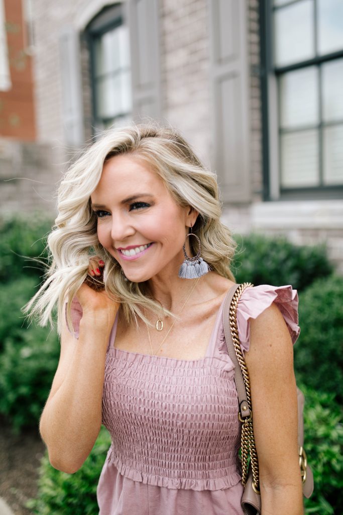 Festival Outfit Ideas featured by top US fashion blog Hello! Happiness; Image of a woman wearing ASOS jumper, See by Chloe shoes, GG Marmont bag and AC earrings.