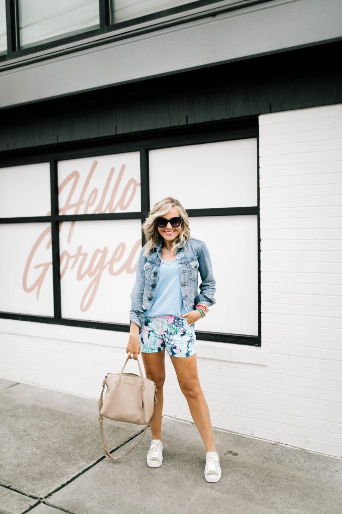 Hip Hip Hooray... The Lilly After Party Sale is Here! by popular Nashville fashion blog, Hello Happiness: image of a woman wearing a Lilly Pulitzer Etta pom pom top and Malie stretch shorts. 