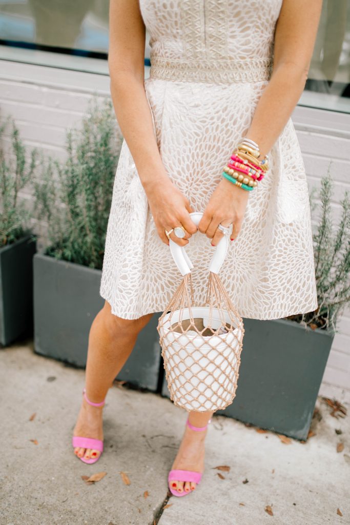 Hip Hip Hooray... The Lilly After Party Sale is Here! by popular Nashville fashion blog, Hello Happiness: image of a woman wearing a Lilly Pulitzer FRANCI HIGH COLLAR DRESS, Amazon Miuco Women Nets Bucket Handbags Straw Tote Bag Purses, Able MARGARIT RAW EDGE JACKET, Sam Edelman Women's Yaro Ankle Strap Block Heel Sandals, and Julie Vos Savannah Statement Ring.