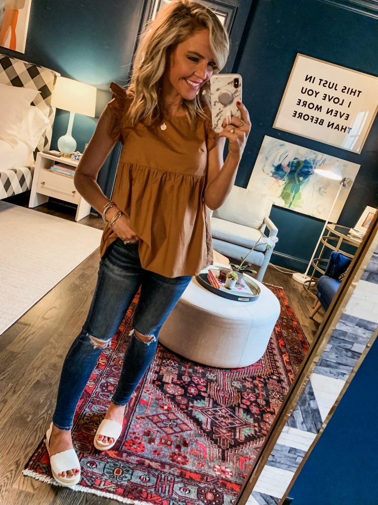 Amazon Favorites featured by top US fashion blog Hello! Happiness; Image of a woman wearing ruffle hem blouse from Amazon.