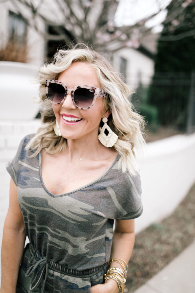 Z Supply by popular Nashville fashion blog, Hello Happiness: image of a woman wearing a Z Supply camo blaire romper, snakeskin espadrilles, cotton cord bag, raffia earrings.