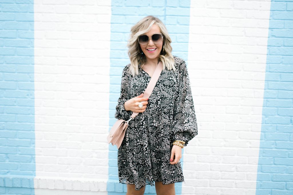 Say Hello to the Vici Collection in 2020! by popular Nashville fashion blog, Hello Happiness: image of a woman wearing a Vici GONNA BE FOREVER RUFFLE TIERED DRESS, Vici HERMIONE FAUX LEATHER CROSSBODY BAG, and Vici ACCOMPANY HEELED BOOTIE - TAUPE.