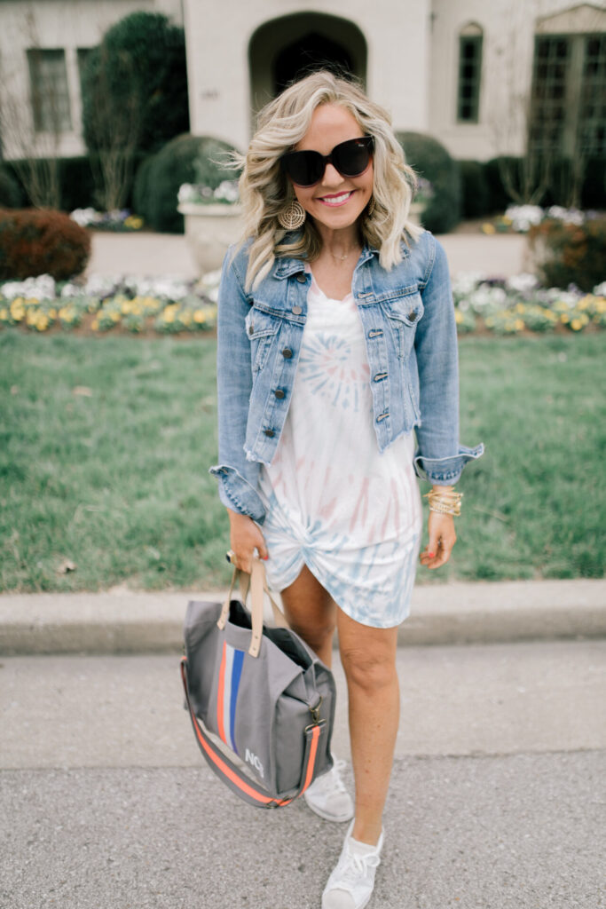 Z Supply by popular Nashville fashion blog, Hello Happiness: image of a woman wearing a Z Supply Naibi cropped jacket, tie dye side knot dress, tote-ally bag, and rezza sneakers.