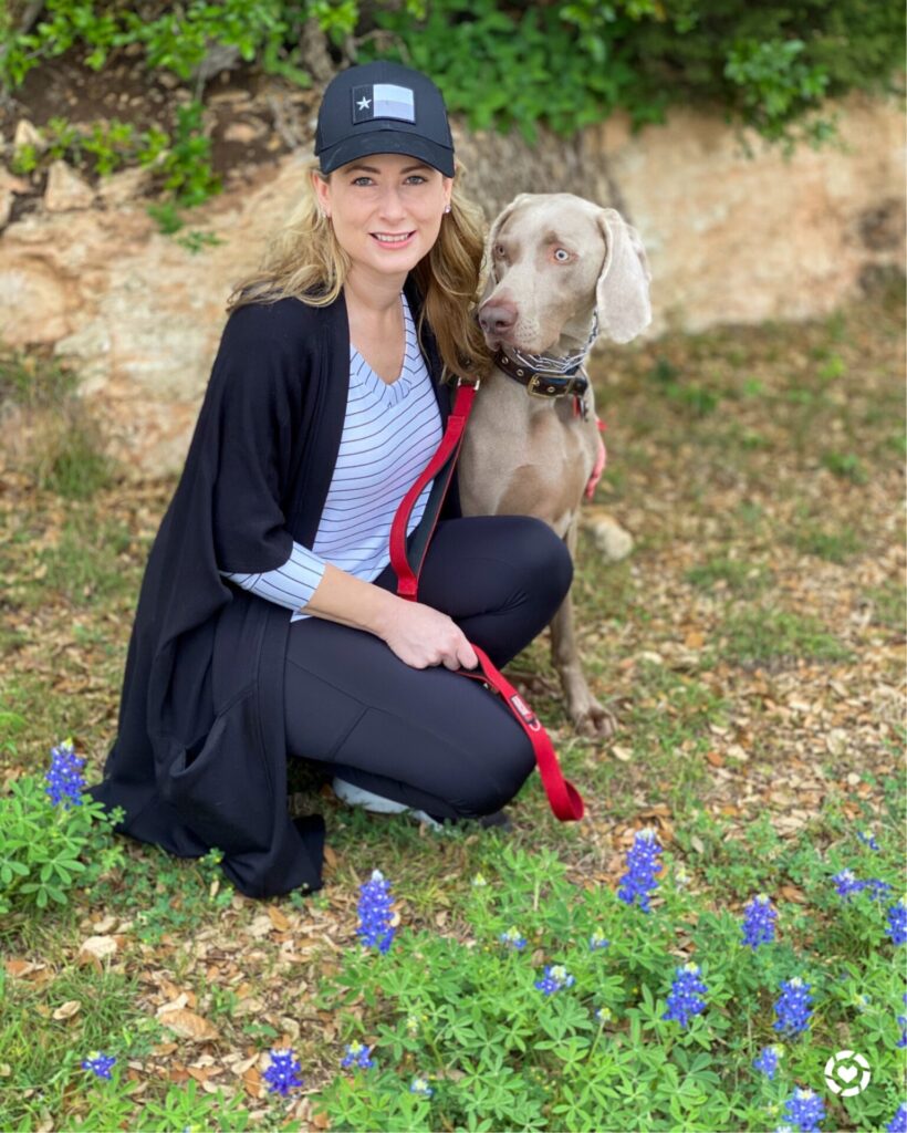 Puppy Products by popular Nashville life and style blog, Hello Happiness: image of Ms Gold Girl kneeling next to her dog. 