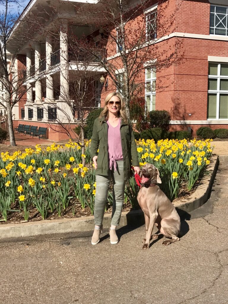 Puppy Products by popular Nashville life and style blog, Hello Happiness: image of Ms Gold Girl standing next to her dog. 