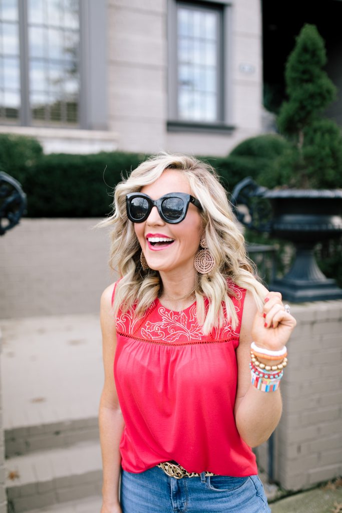 Let's Getaway... The Gibson Resort x Hi Sugarplum Collection is Here! by popular Nashville fashion blog, Hello Happiness: image of a woman wearing a Hi Sugarplum  Limone Floral Yoke Sleeveless Top, ShopBop Levi's 721 High Rise Distressed Skinny Jeans, Bagging Rights Toteally Bag, Zappos SOLE / SOCIETY Audrina, Amazon SANSTHS Womens Leopard Belt SANSTHS Ladies Leopard Print Leather Waist Belt, Amazon Freckles Butterfly Sunglasses Semi Cat Eye Glasses Plastic Frame Clear Gradient Lenses, and The Accessory Scout earrings. 