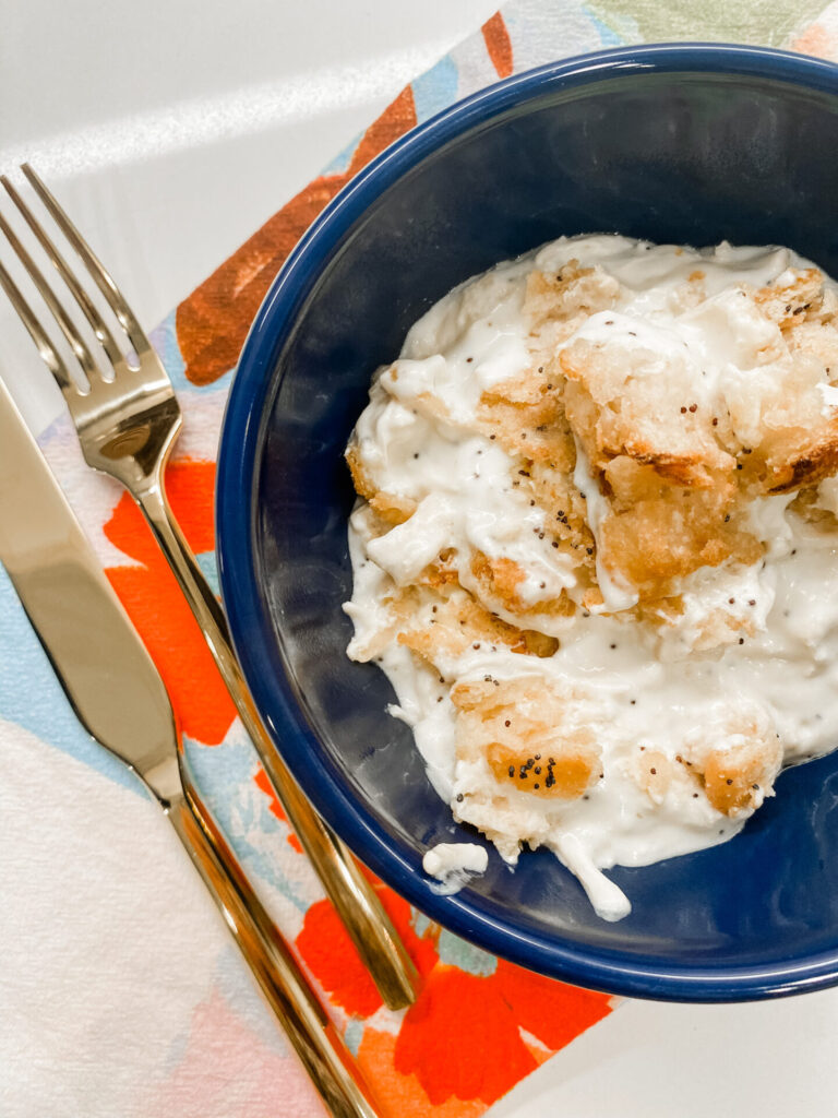 Weeknight Meals by popular Nashville lifestyle blog, Hello Happiness: image of poppyseed chicken casserole in a blue bowl.
