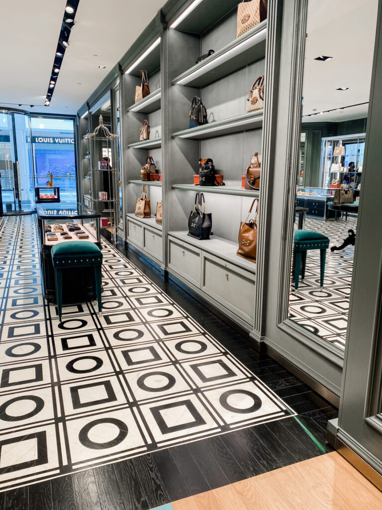 Staycation Ideas by popular Nashville travel blog, Hello Happiness: image of a designer bag display. 