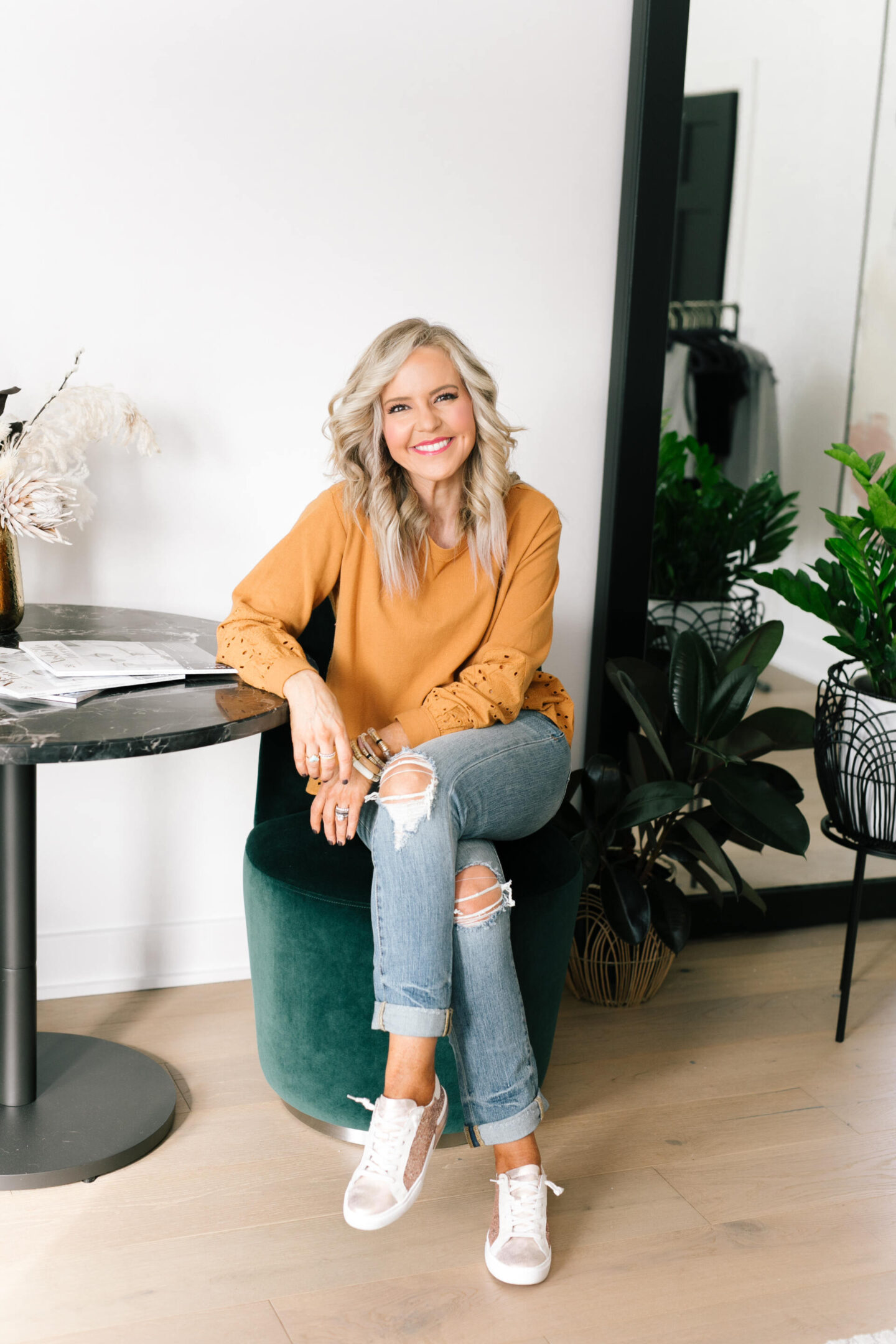 Anthro x Pilcro by popular Nashville fashion blog, Hello Happiness: image of Natasha Stoneking wearing some Anthro x Pilcro jeans and a orange eyelet long sleeve top. 