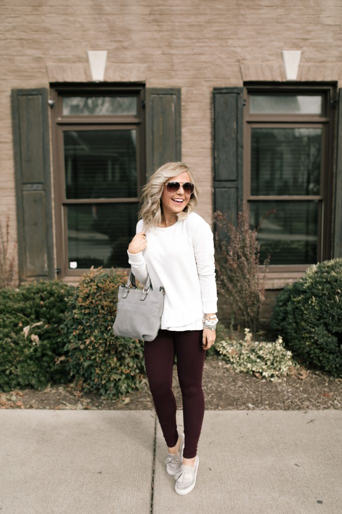  The 12 Days of YAY from Loft... $25 Sweatshirts + Fleece by popular Nashville fashion blog, Hello Happiness: image of a woman outside wearing a Loft FUNNEL NECK SWEATSHIRT and Loft HIGH WAIST LEGGINGS IN SEAMED PONTE.