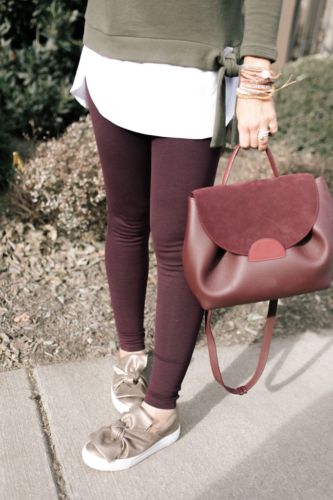  The 12 Days of YAY from Loft... $25 Sweatshirts + Fleece by popular Nashville fashion blog, Hello Happiness: image of a woman outside wearing a Loft TIE HEM SWEATSHIRT and Loft HIGH WAIST LEGGINGS IN SEAMED PONTE.