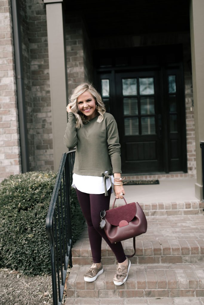  The 12 Days of YAY from Loft... $25 Sweatshirts + Fleece by popular Nashville fashion blog, Hello Happiness: image of a woman outside wearing a Loft TIE HEM SWEATSHIRT and Loft HIGH WAIST LEGGINGS IN SEAMED PONTE.
