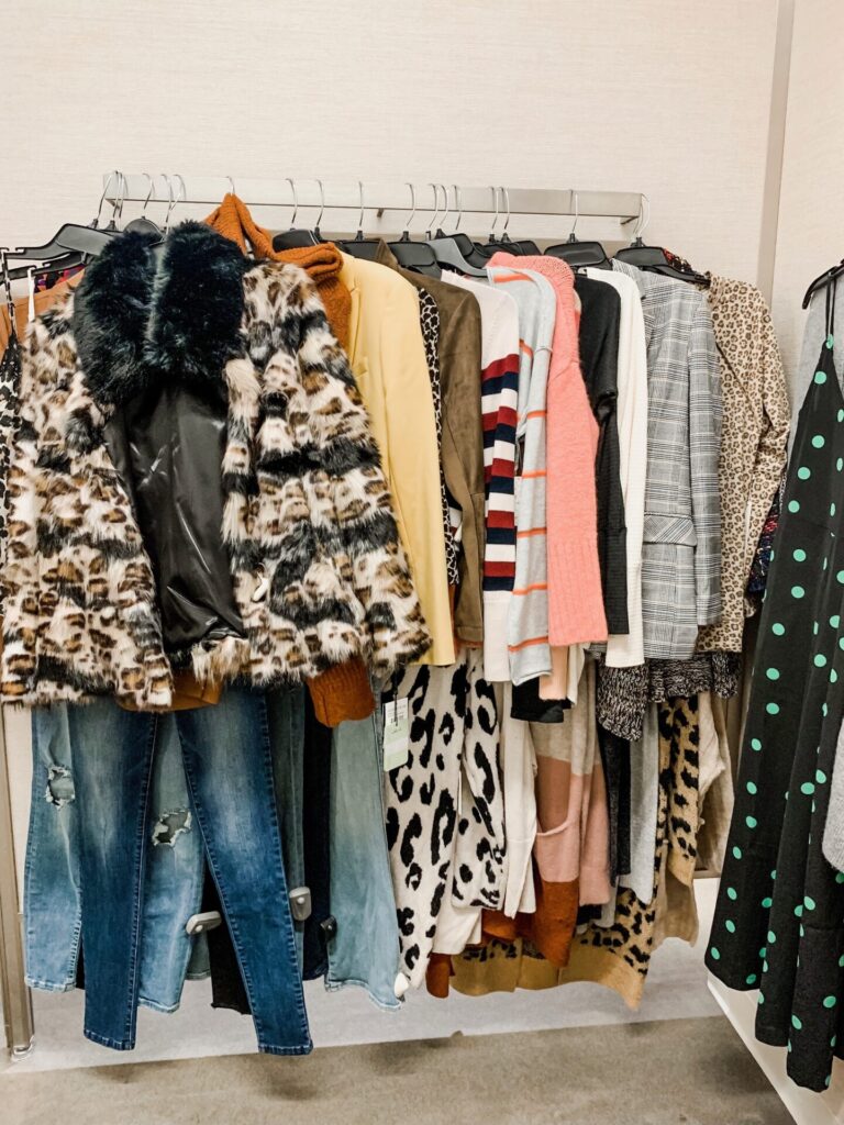 Nordstrom Anniversary Sale by popular Nashville fashion blog, Hello Happiness: image of various Nordstrom clothing items hanging on a clothes rack. 