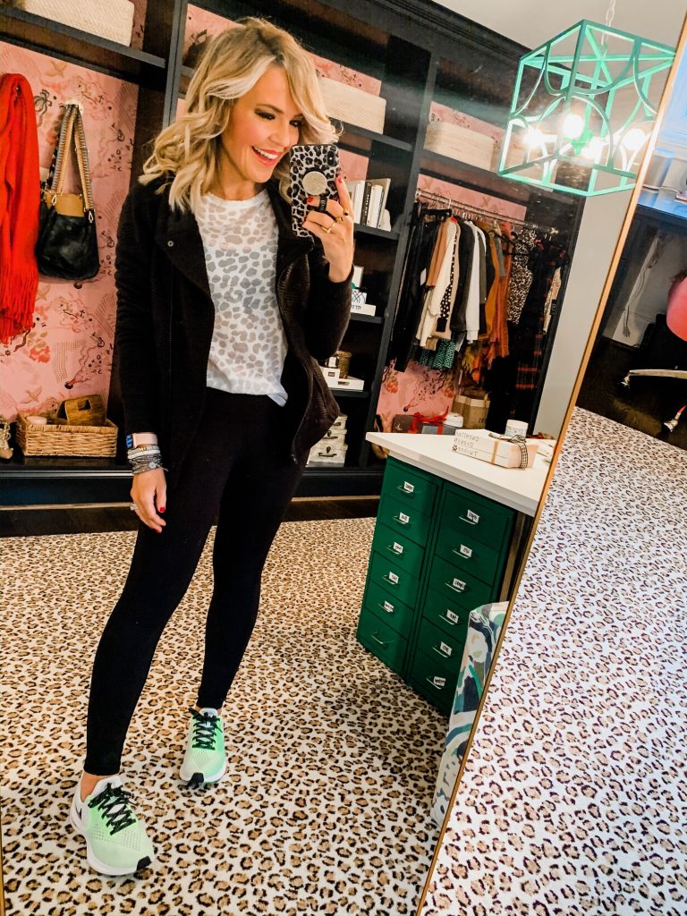 Unwrap the Magic of Sports with Dick's Gift Ideas by popular Nashville life and style blog, Hello Happiness: image of a woman wearing a Dick's DSG Women's Quilted Jacket, Dick's DSG Women's Core Cotton Jersey Long Sleeve Shirt, Dick's DSG Women's Performance 7/8 Leggings, and Dick's DSG Women's Compression Sports Bra.