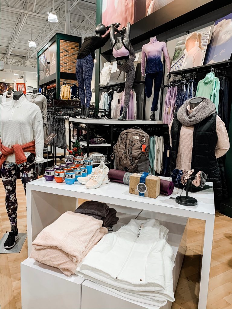 Unwrap the Magic of Sports with Dick's Gift Ideas by popular Nashville life and style blog, Hello Happiness: image of Dick's Nike Quarter Zip, Nike Printed Leggings, Nike Air Max Sneakers, CALIA Heather Scarf, CALIA Cowl Neck Sweater, CALIA Puffer Vest, The North Face Backpack, Manduka Yoga Mat + Yoga Block, YETI Tumblers + Wine Tumblers