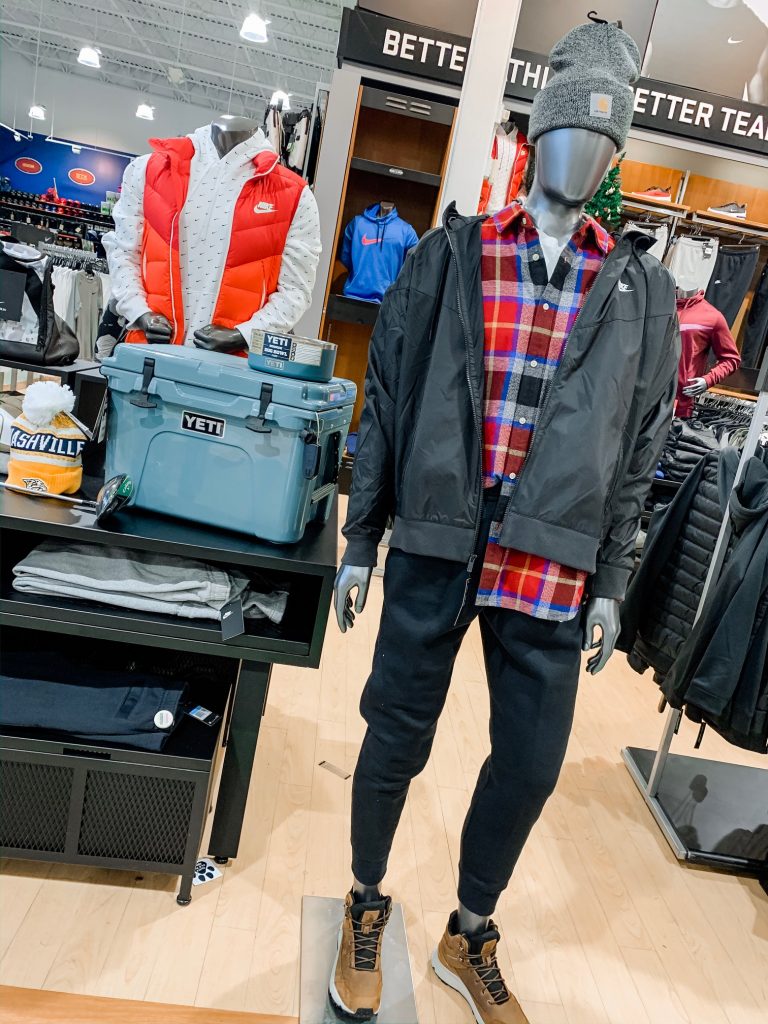 Unwrap the Magic of Sports with Dick's Gift Ideas by popular Nashville life and style blog, Hello Happiness: image of a Dick's Nike Running Jacket, The North Face Flannel Shirt, Nike Fleece Joggers, The North Face Waterproof Hiking Boots, Carhartt Beanie, Predators Watch Beanie, YETI Roadie 20 (River Green, YETI Baxter + Boomer Dog Bowls.